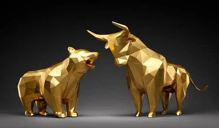 125507800-golden-bull-and-bear-in-front-of-dark-background